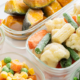 Assorted frozen vegetables in glass containers, including cauliflower florets, carrots, bell peppers, and green beans.